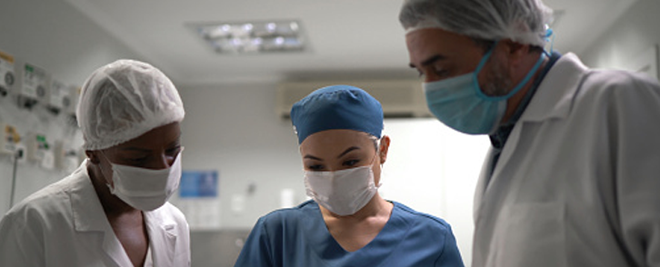 Two Boston Children's Hospital doctors and a nurse working together.